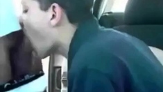 Sucking a cock seated in his car