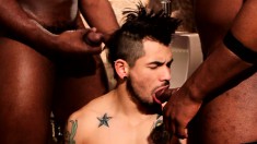Tattooed white stud gets his mouth and ass pounded hard by two black cocks