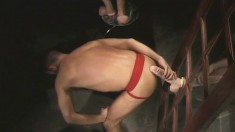 Hot hunk in a red jockstrap bends over to take a huge dildo up his ass