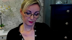 Blonde MILF takes off bra on webcam