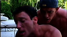 Gay porn action at the pool turns into a threesome with a peeping Tom