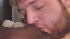 White stud has his lips and hands working all over a big black cock